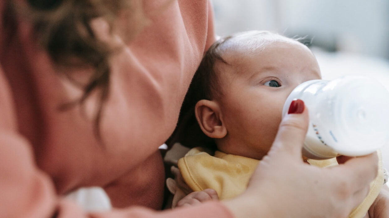 Baby being fed a bottle