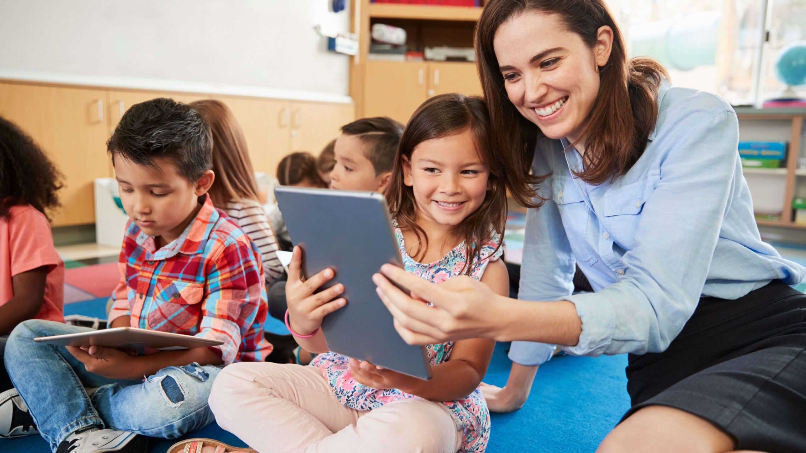 Daycare teacher using technology