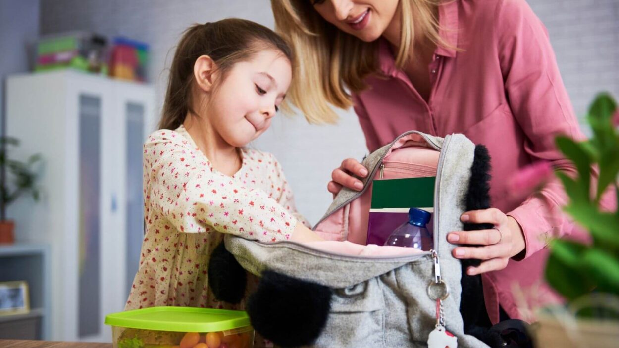 Child packing their bag for summer camp