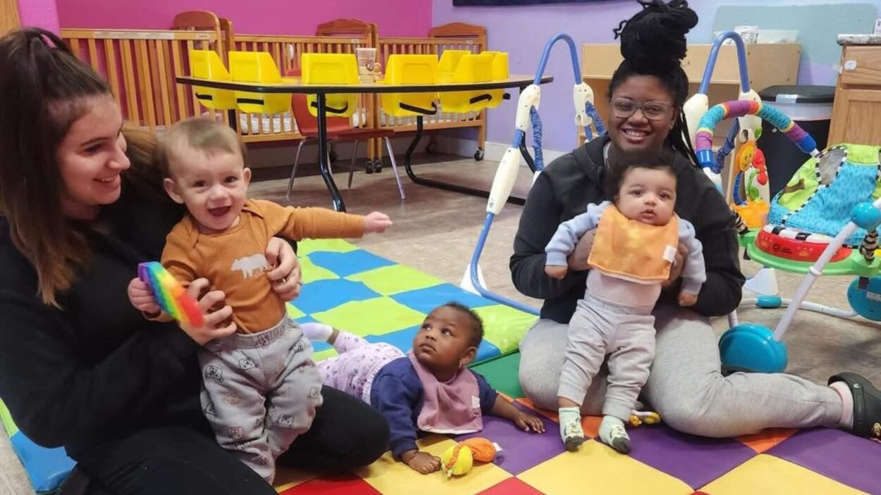 daycare teachers holding toddlers