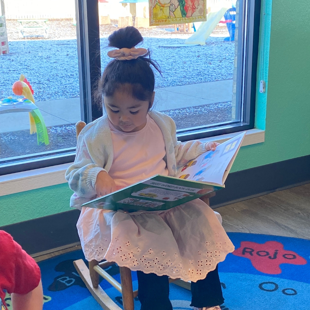 Child reading at daycare