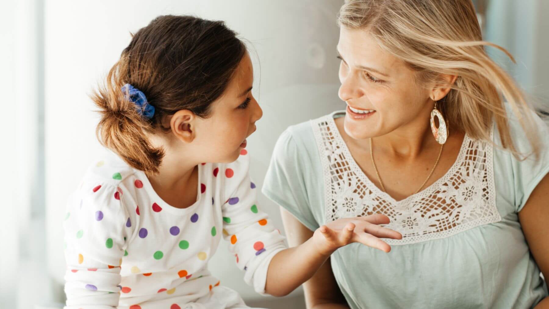 young girl talking to woman young girl talking to woman