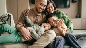 family sitting together playing with toys